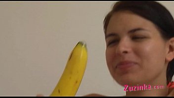How-to: Young brunette girl teaches using a banana