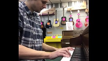 Tom explores the piano at Bur ‘s showcase store