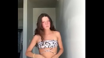 Shaved teen Doing a striptease