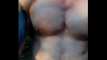 Muscular guy is jerking off and in forrest with cum